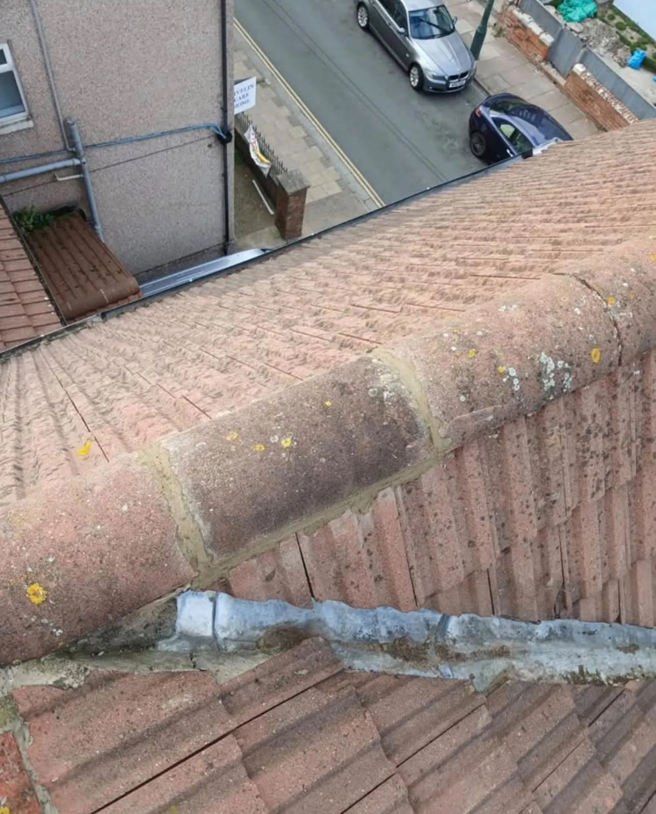 Ridge tiles rebedded and lead flashing